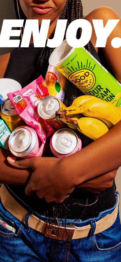 A person holding a variety of snacks and drinks from Gopuff including chips bananas and soda