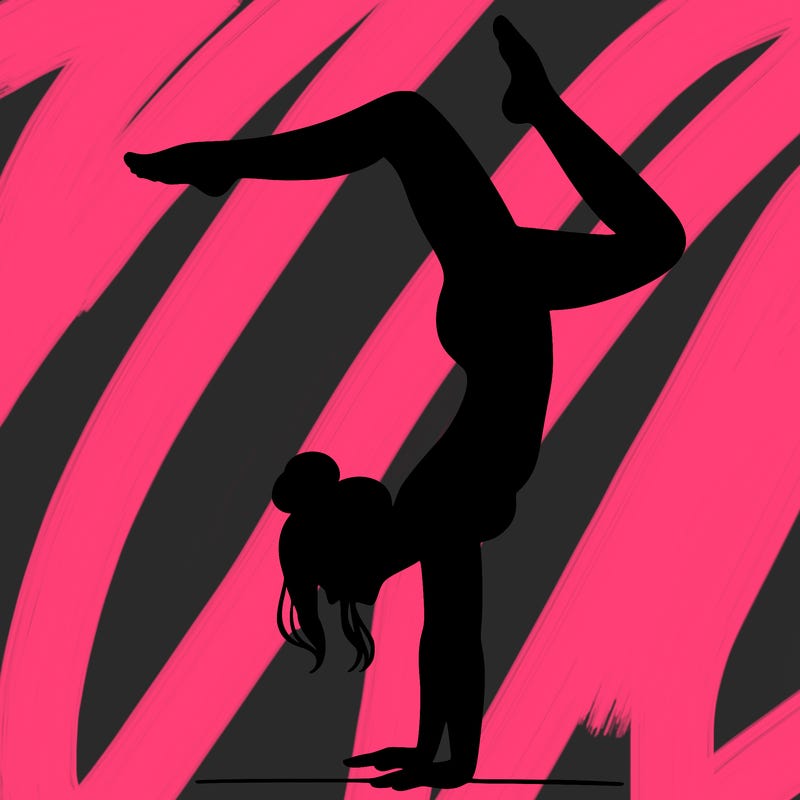 a woman doing a handstand