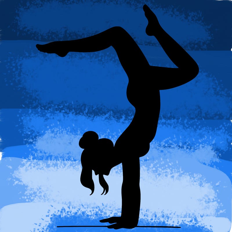 a woman doing a handstand