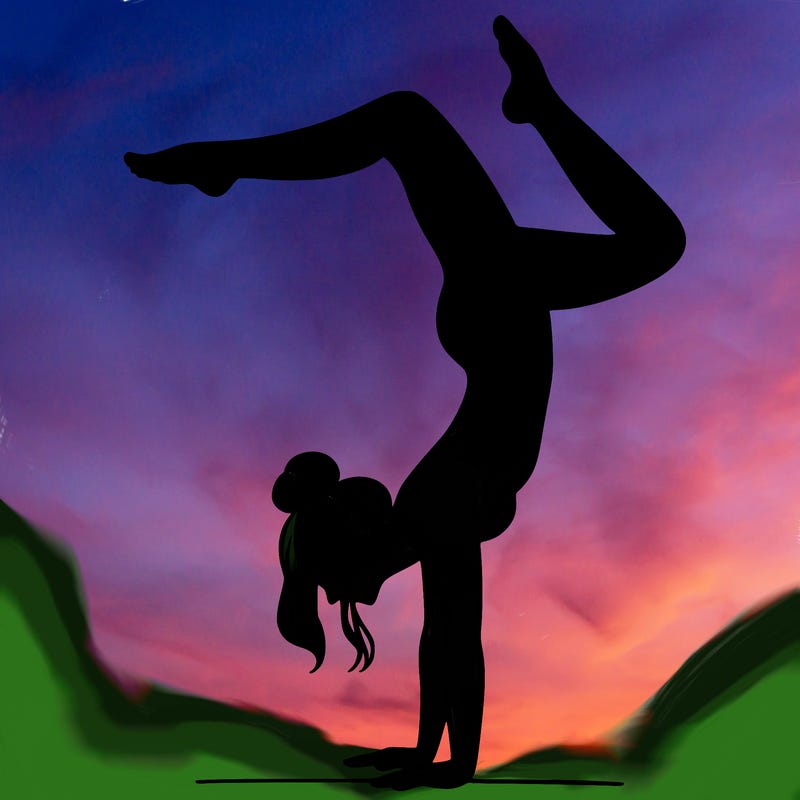 a woman doing a handstand