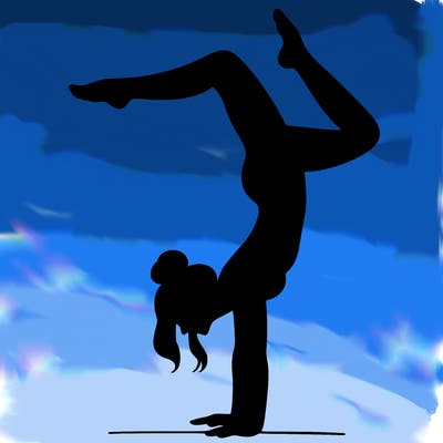 a woman doing a handstand