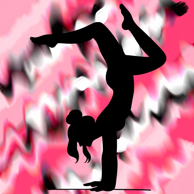 a woman doing a handstand
