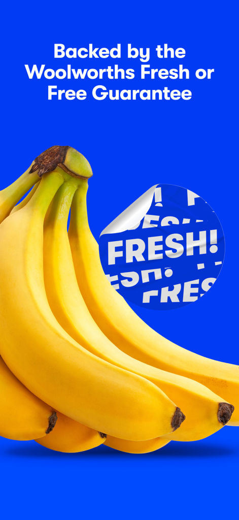 Yellow bananas with a Woolworths Fresh or Free Guarantee sticker on a blue background