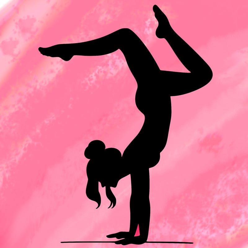 a woman doing a handstand