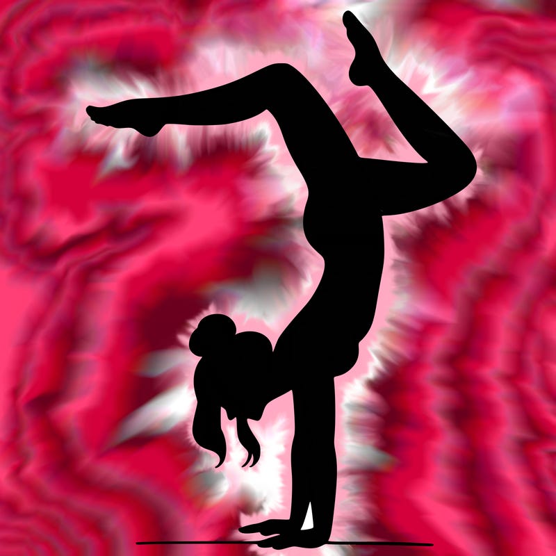 a woman doing a handstand