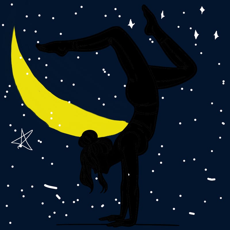 a woman doing a handstand