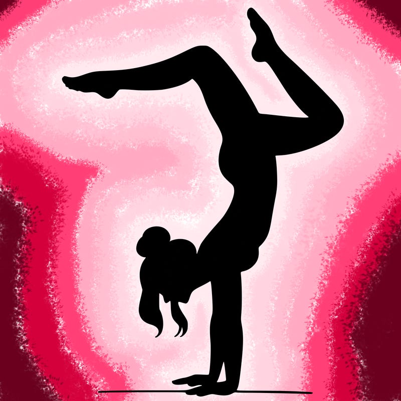 a woman doing a handstand
