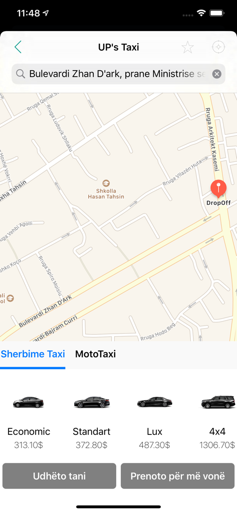 UP's Taxi - Interface do aplicativo móvel UP's Taxi mostrando um mapa com um pino de destino e várias opções de categorias de veículos, incluindo carros econômicos e de luxo com seus preços