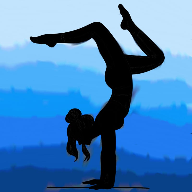 a woman doing a handstand