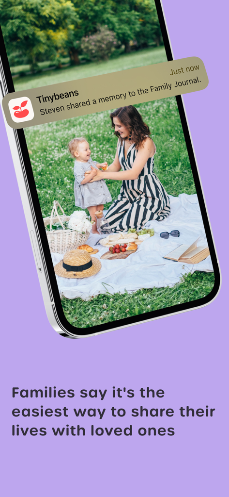 Tinybeans Private Family Album - Tinybeans app notification showing a shared family memory with a photo of a mother and child having a picnic