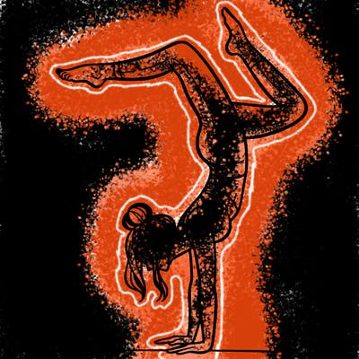 a woman doing a handstand