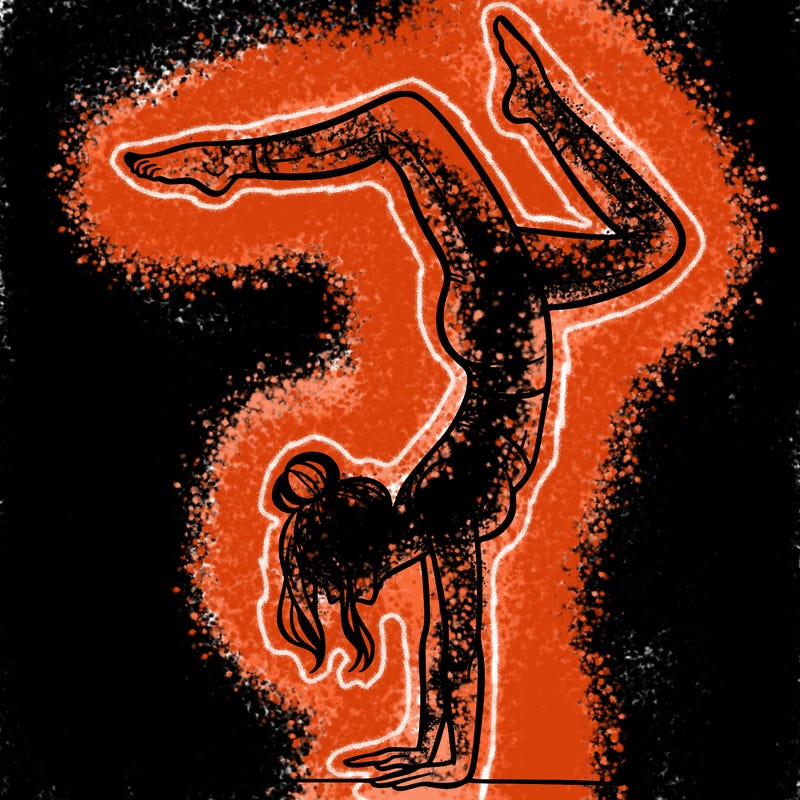 a woman doing a handstand