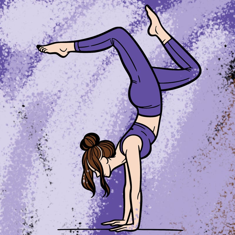 a woman doing a handstand