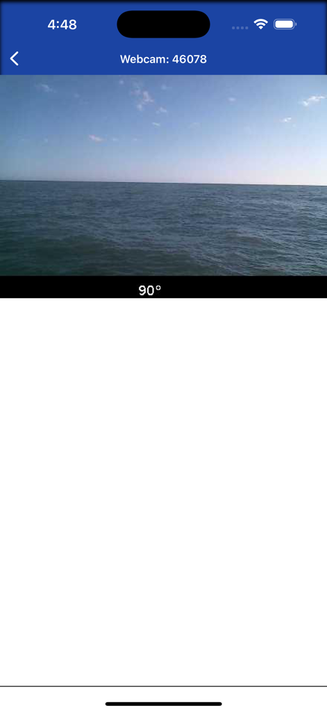 Live marine webcam view from a buoy showing the ocean surface under a clear sky
