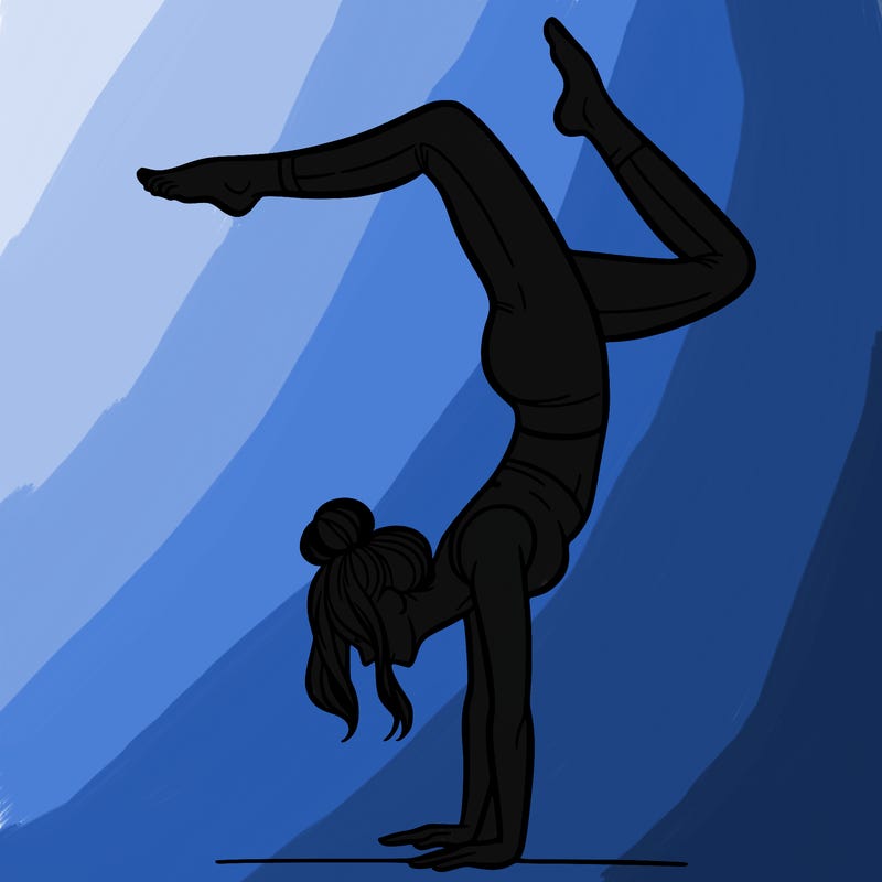 a woman doing a handstand