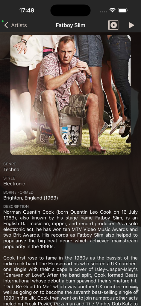 Artist profile page in the Official Kodi Remote app featuring a biography and photo of Fatboy Slim