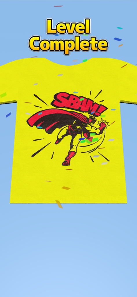 Masking Print - A completed level in the Masking Print app showing a yellow t-shirt with a superhero graphic and confetti