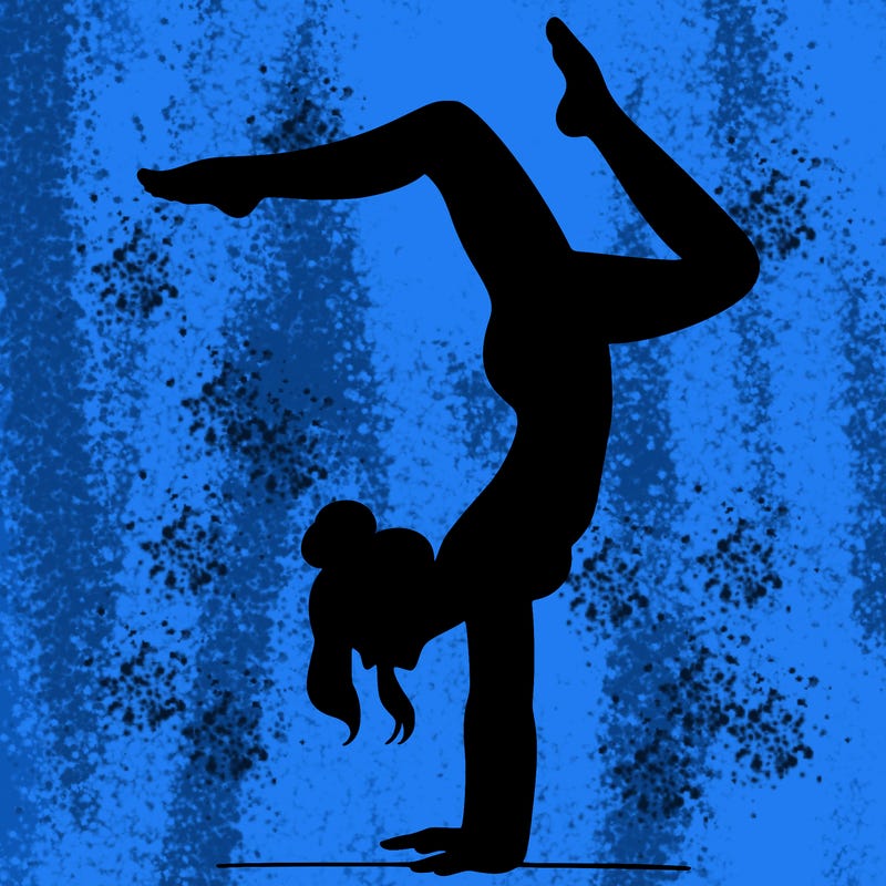 a woman doing a handstand