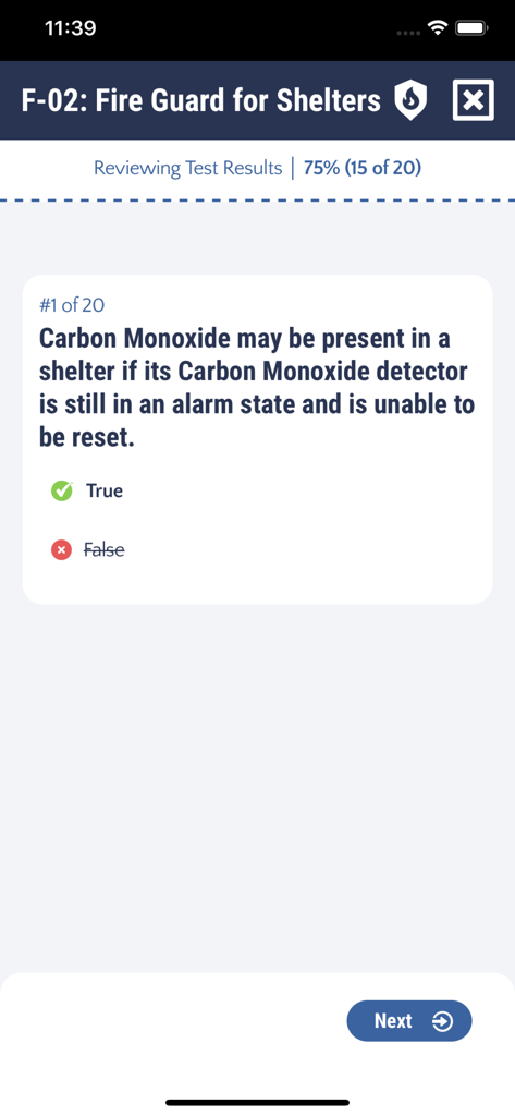 Practice test review screen showing a true or false question about carbon monoxide detectors in the F-02 Fire Guard for Shelters app.