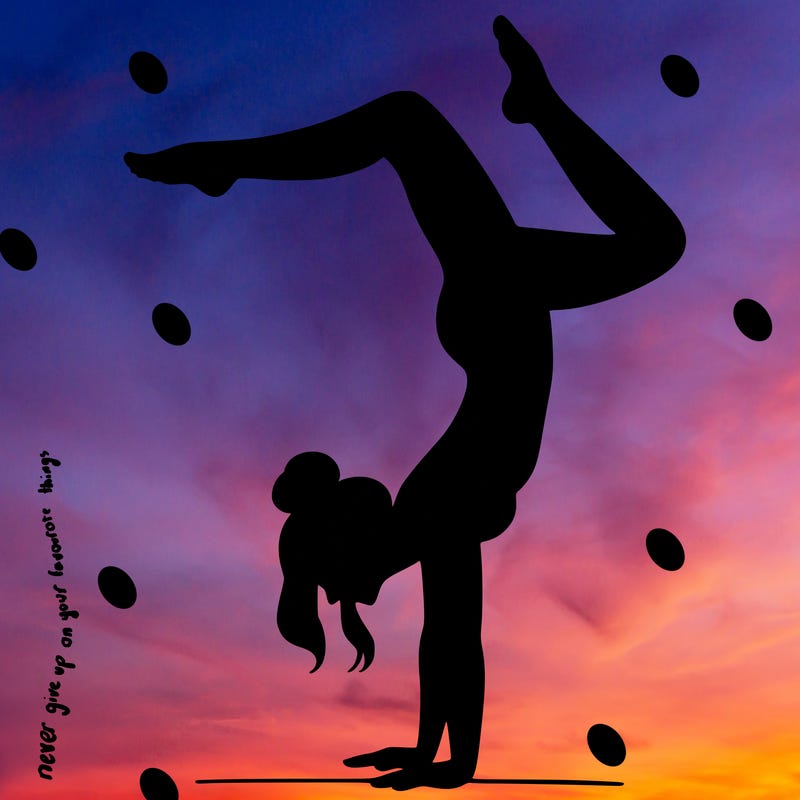 a woman doing a handstand