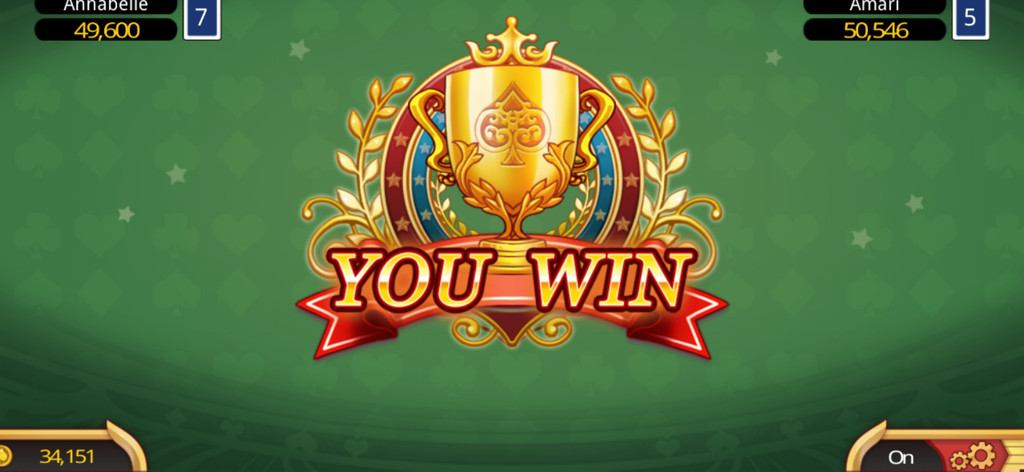 녹색 테이블에 황금 트로피와 'You Win' 텍스트를 보여주는 펀 빅 2 카드 게임의 승리 화면