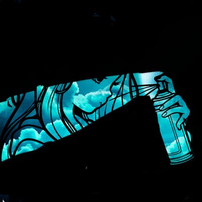 a realistic girl spray painting