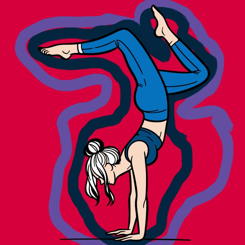 a woman doing a handstand