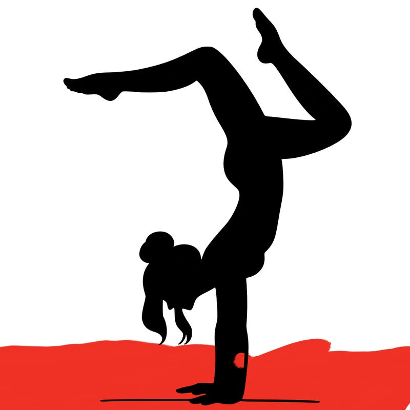 a woman doing a handstand