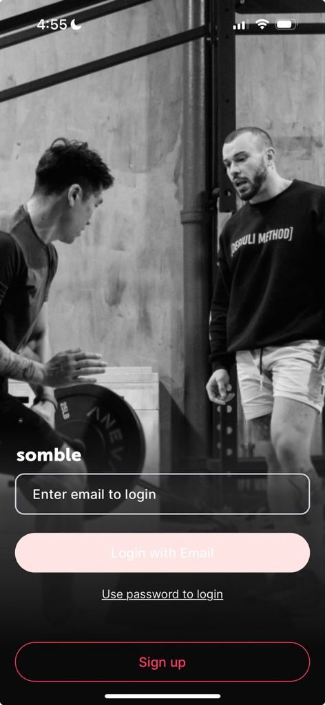 Somble - Somble app login and sign up screen featuring a coach and client in a gym background.