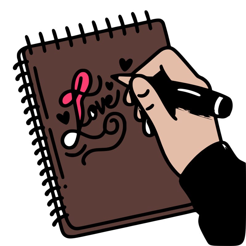 a hand writing “love” in calligraphy on a notebook
