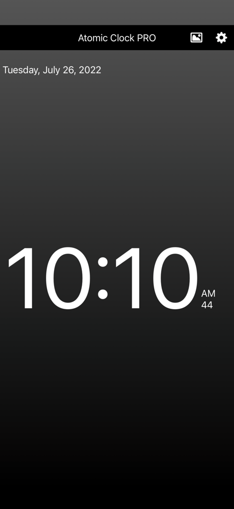 Atomic Clock PRO - Atomic Clock PRO app displaying precise digital time and date on a dark background.
