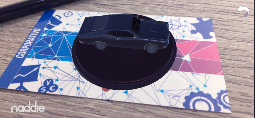 Naddie AR - A 3D model of a black car visualized on a physical Naddie AR card.