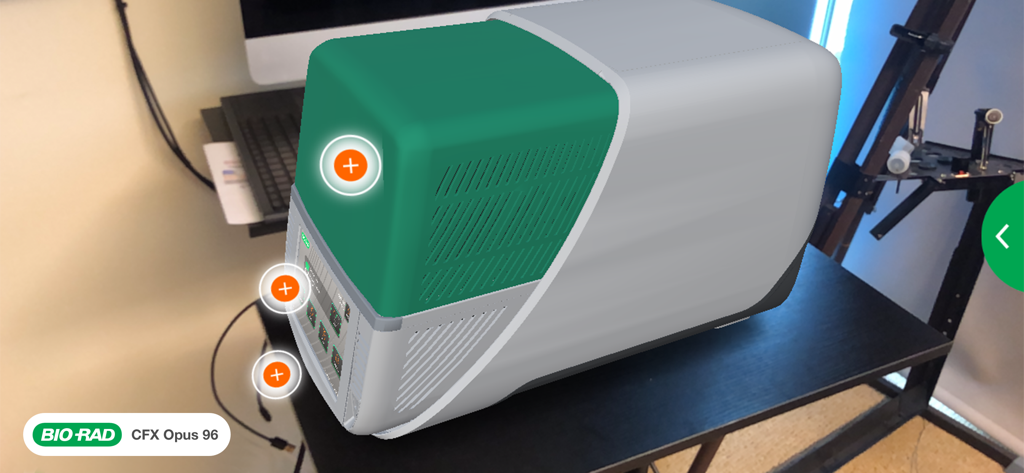 Bio-Rad AR - Augmented reality visualization of the Bio-Rad CFX Opus 96 PCR system placed on a laboratory desk with feature highlights