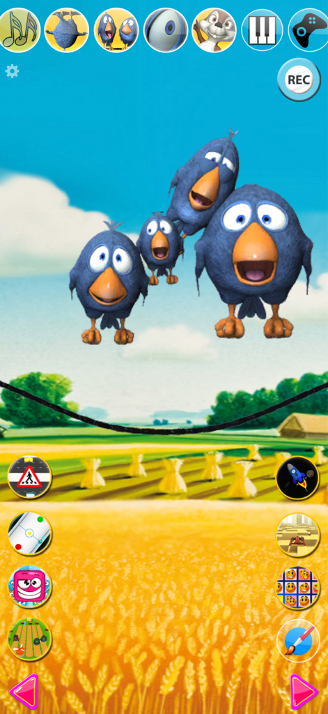 Talking Birds On A Wire - Four blue cartoon birds with large beaks on a screen featuring various mini-game icons and a sunny field background.