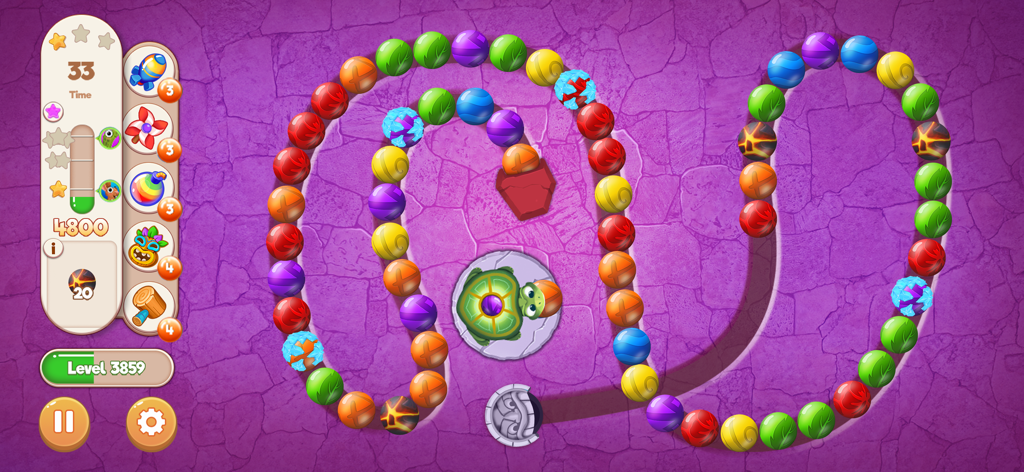 Marble Woka Woka gameplay showing a turtle shooting colored marbles on a path