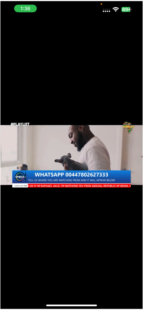 OMEGA TV UK - Omega TV UK app interface showing a music video live stream with interactive viewer comments.