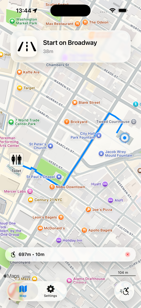 A mobile app screen showing turn-by-turn navigation on a map in New York City to find a nearby toilet with a wheelchair accessibility filter enabled.