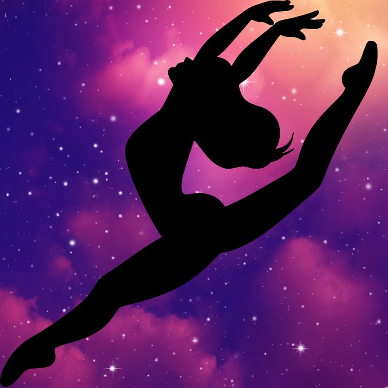 dancer doing a leap ina leotard