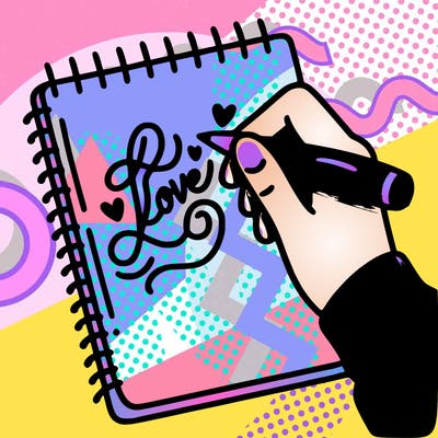 a hand writing “love” in calligraphy on a notebook