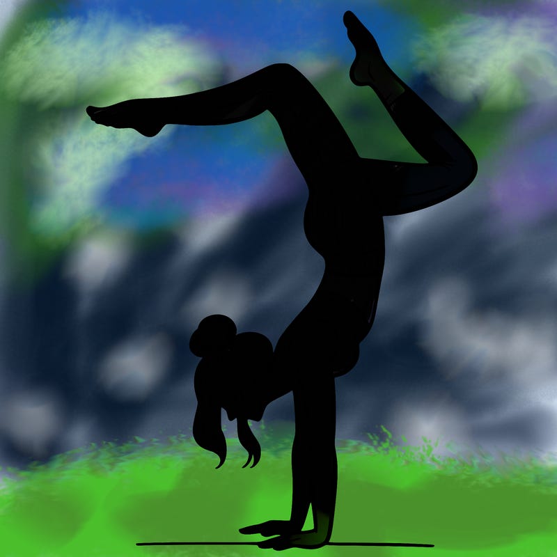 a woman doing a handstand