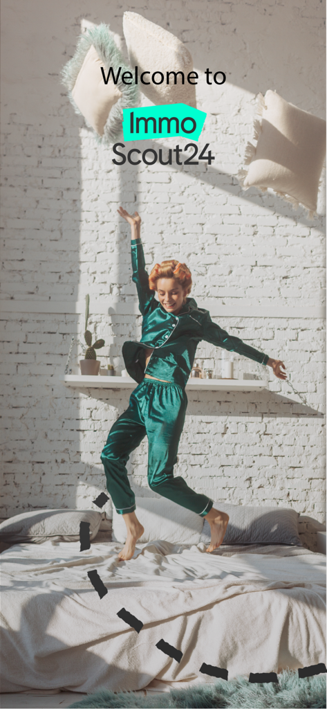 Happy woman jumping on a bed in a bright bedroom with ImmoScout24 branding