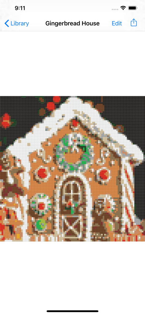 Un design de mosaïque LEGO pixélisé d'une maison de pain d'épices festive avec de la neige sur le toit