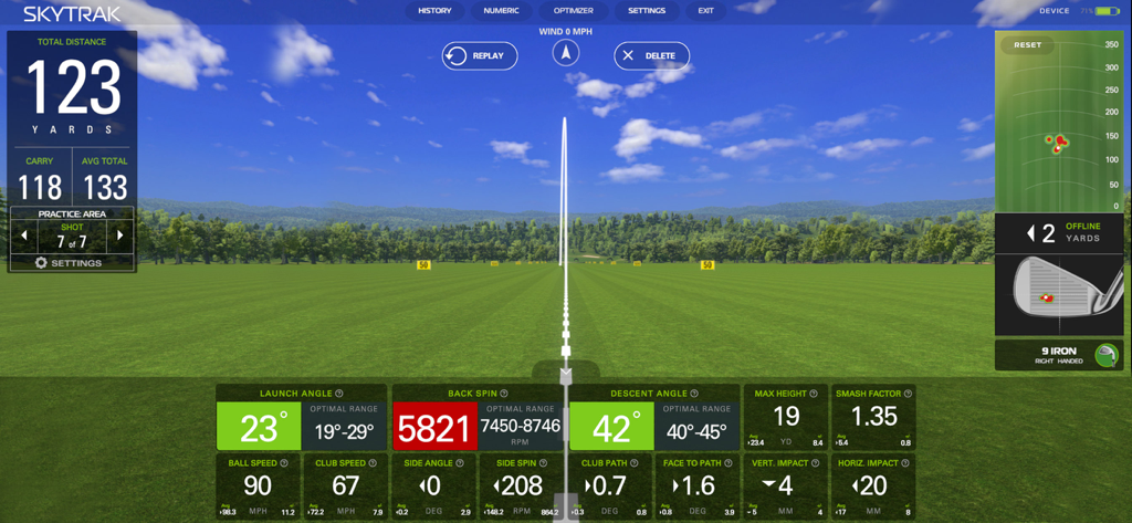 SkyTrak Lite app interface displaying golf shot metrics and trajectory on a virtual range.