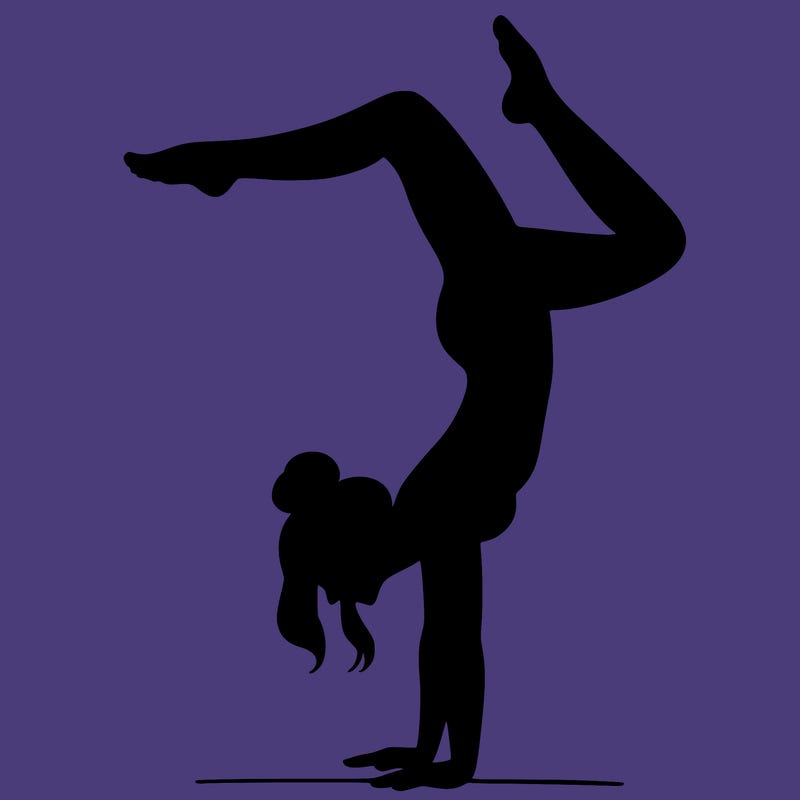 a woman doing a handstand