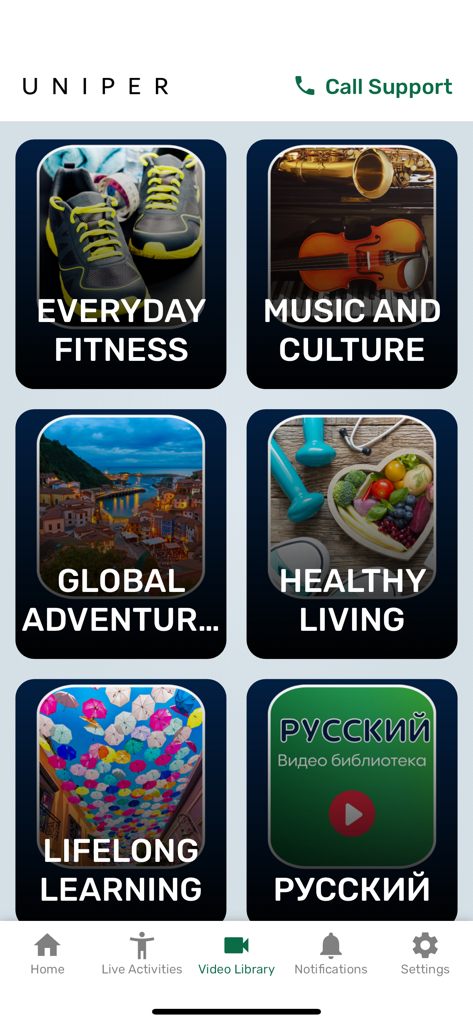 Pantalla de la biblioteca de videos de la aplicación Uniper con grandes mosaicos de categorías para actividades de personas mayores como fitness y cultura.