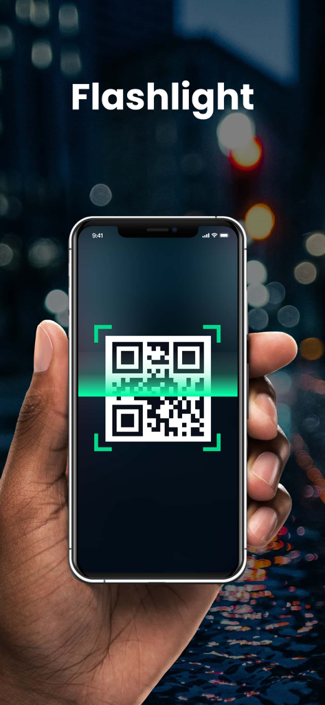 A hand holding an iPhone using the QR and barcode scanner app with flashlight support in a low-light environment