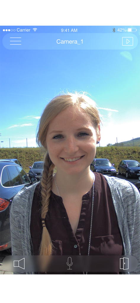 MOBOTIX LIVE - MOBOTIX LIVE app interface showing a live video feed of a visitor at a security door station