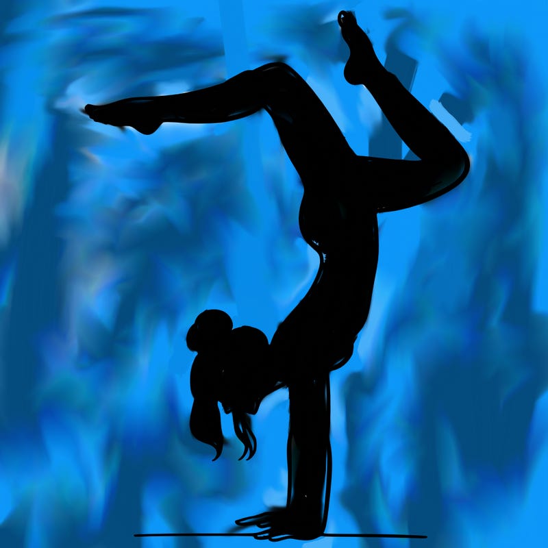 a woman doing a handstand