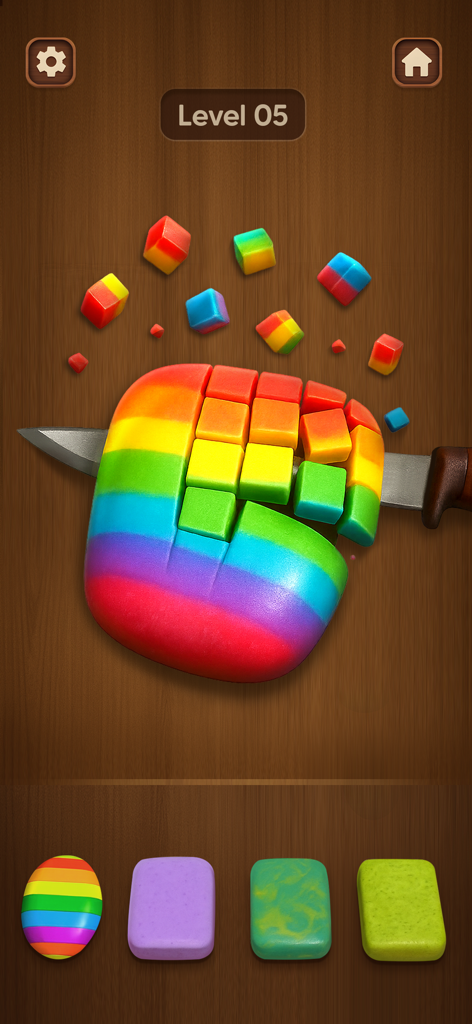 A knife slicing a rainbow-colored block into small cubes in the Relaxing Toys mini game
