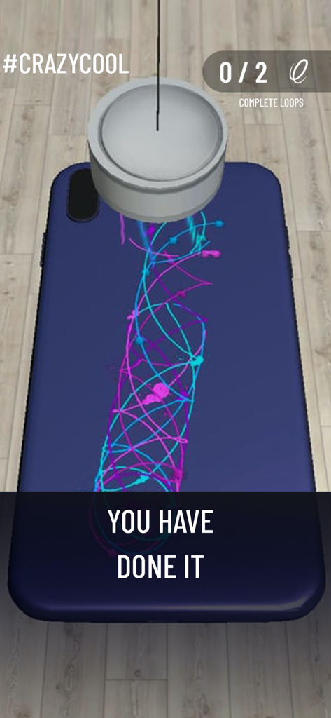 A digital pendulum creating colorful neon patterns on a dark blue phone case in the I Can Paint mobile game.
